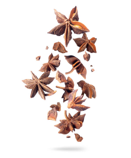 istock Crushed dry anise in the air isolated on white background 1217860742