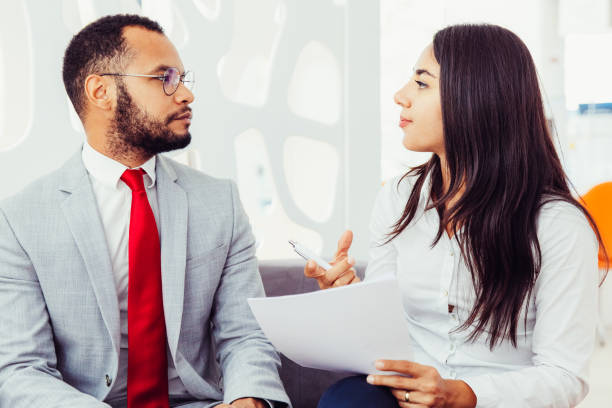 istock Professional young business colleagues discussing contract 1217862252