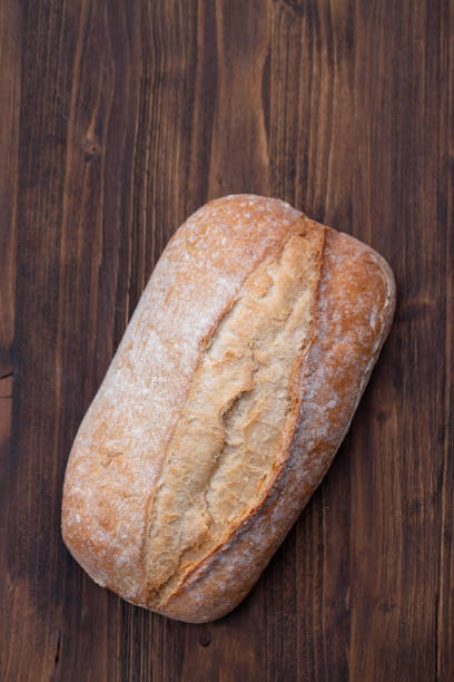 istock bread on gray brown wooden background 1217865294