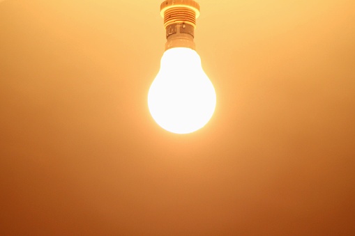 A light bulb with yellow light