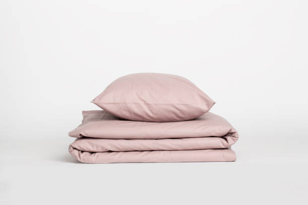 Bedding set Studio shot of a bedding set in beige. bedding stock pictures, royalty-free photos & images
