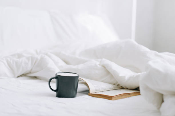 istock cup of coffee on a bed 1217867063