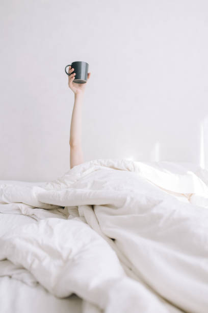 istock A young girl holds a cup of coffee 1217867441