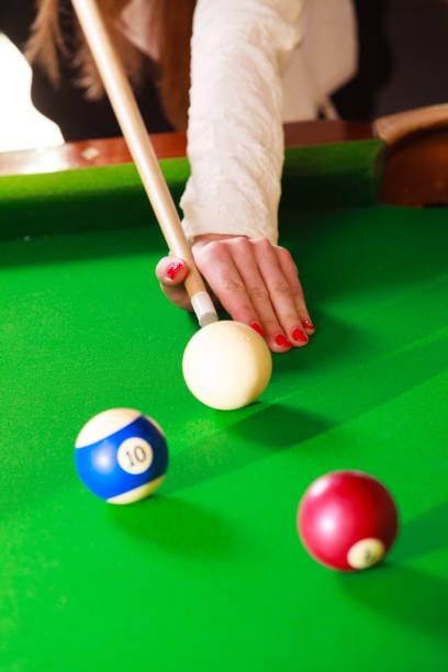 istock Close up on girl hand playing billiard. 1217868026
