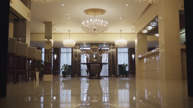 Luxurious reception zone in high-class hotel. Interior of beautiful hall for wealthy clients. Accommodations, tourism business, luxury, richness.