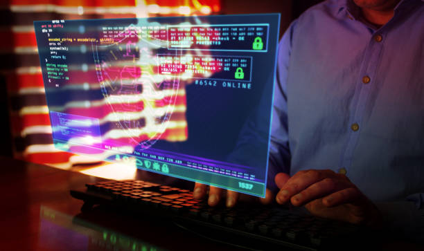 istock Man typing on keyboard with security shield symbol hologram screen 1217869702