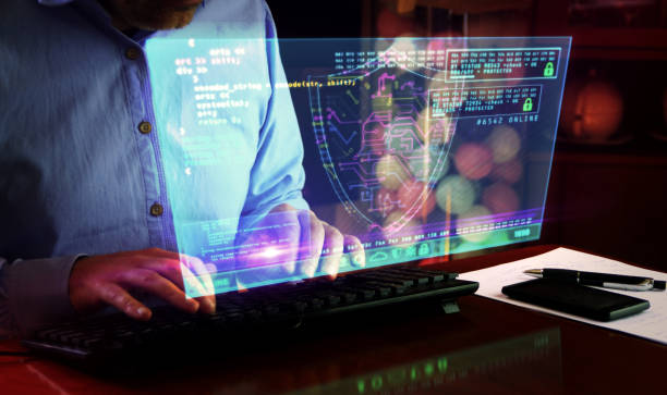istock Man typing on keyboard with security shield symbol hologram screen 1217870560