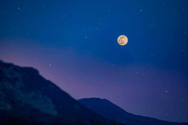 istock Landscape With Clear Sky With Full Moon and Stars 1217870563