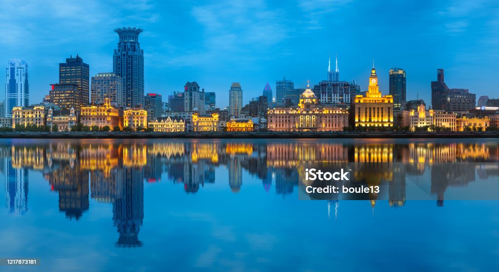 Shanghai skyline with the city lights and tower Beautiful chinese cityscape of Shanghai's skyline with the city lights and tower on the Huangpu River bay, Shanghai, China. The Bund Stock Photo
