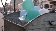 istock Bunch of balloons in garbage bin for non recycle products 1217873223