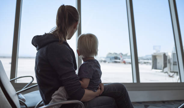 istock Mother and son in the airport. 1217874678