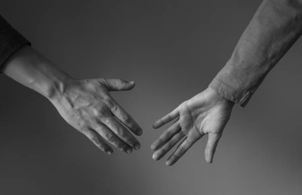 istock Couple is about to hold hands. 1217875432