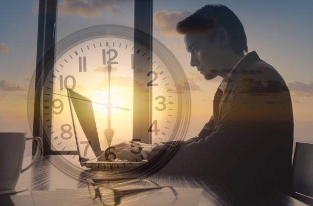 istock Businessman working early morning at office typing on computer. 1217875456