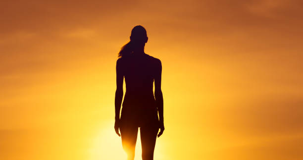istock Woman watching the sunset 1217875599