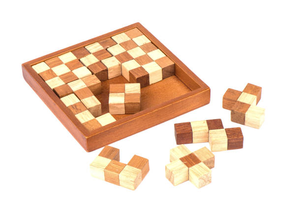 istock Wooden polymino puzzle isolated on a white background. 1217875622