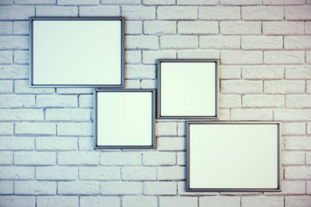 istock Collection of empty banners on white brick wall. 1217875630