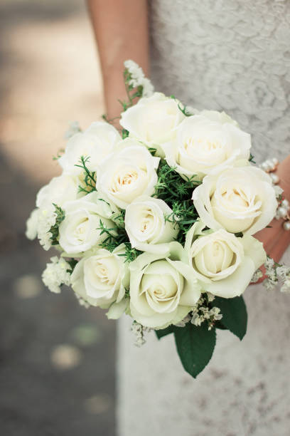istock Wedding bridal bouquet with white roses 1217877274