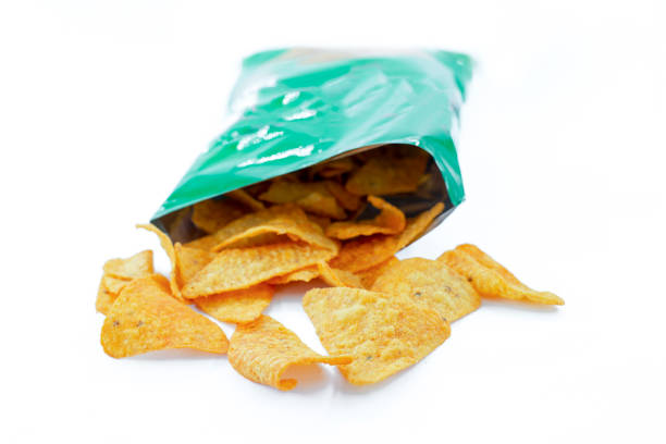 istock Heap of open packages and corn chip 1217878594