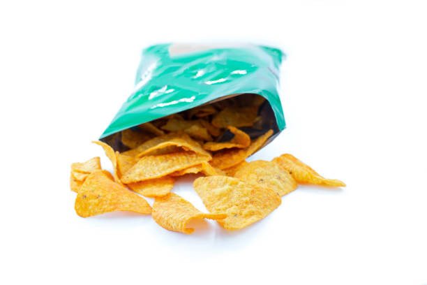 istock Heap of open packages and corn chip 1217878926