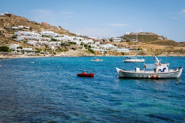 A fishing boat off the shore of Agios Ioannis Beach in Mykonos, Greece.