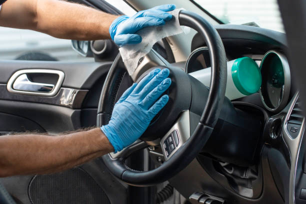 istock A man sanitizes his vehicle 1217881336