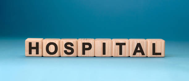 istock HOSPITAL word cube on a blue background. Medical concept. 1217882195