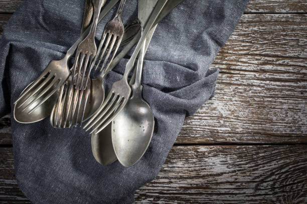 istock A few old silver spoons and forks. 1217882990