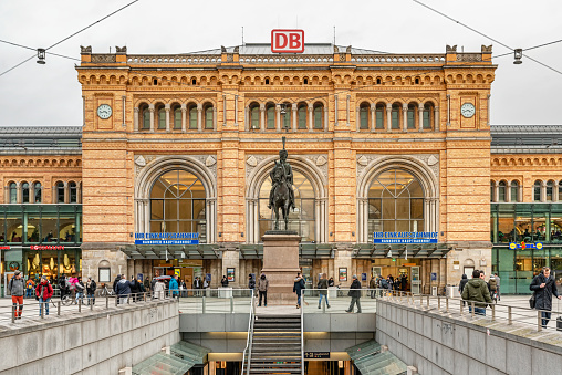 Hannover, Germany - Jan 27, 2019: Facade of Hauptbahnhof Hannover main railway station and Ernst August monument in front of the central train station in Hanover, Germany