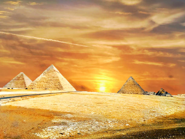 The Pyramids of Giza Cairo in Egypt during a golden sunset summer in the desert The Pyramids of Giza Cairo in Egypt during a golden sunset summer in the desert. Beautiful image picture photography background template pyramid giza pyramids close up egypt stock pictures, royalty-free photos & images