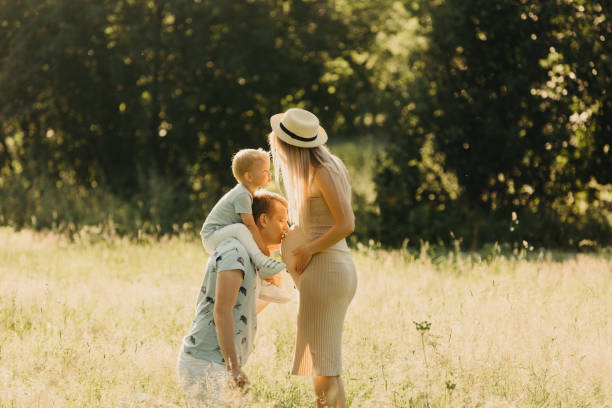 istock Cute family in summer park. 1217892981