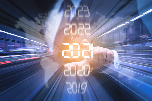 Goal of 2021 New year combined futuristic concept, Businessman pointing at year 2021 stock market data photos stock pictures, royalty-free photos & images