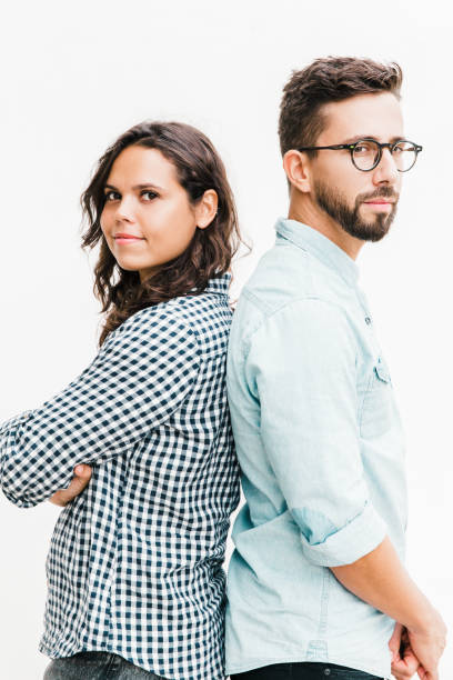 istock Serious pensive couple standing back-to-back 1217894239