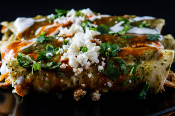 istock Chicken Filled Green Enchiladas, Traditional Mexican Meal 1217895385