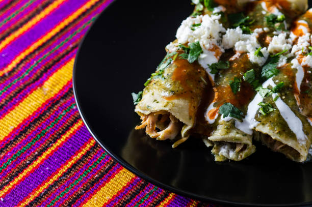 istock Chicken Filled Green Enchiladas, Traditional Mexican Meal 1217896575