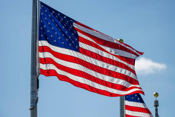 istock American flag waving on pole 1217896641