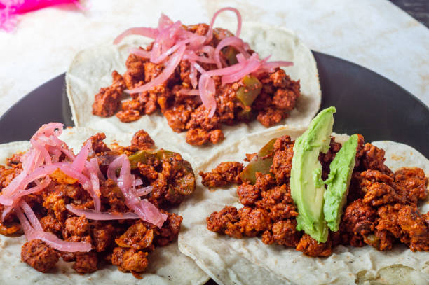 Vegetarian Vegan Cochinita Pibil, Texturized Soy Protein Tacos Vegetarian vegan cochinita pibil tacos. Mexican soya protein tacos in the style of the Yucatan dish. Marinated in annatto, orange juice and various spices on fresh corn tortillas. tsp stock pictures, royalty-free photos & images