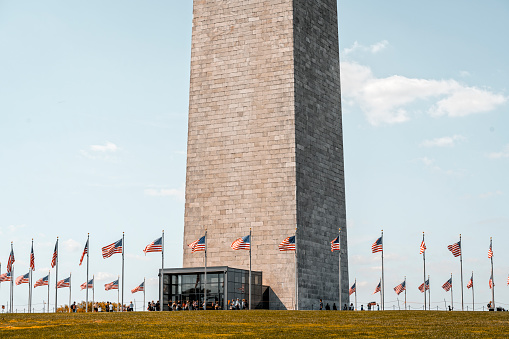 Fifty American flags (not state flags), one for each state, waving 24 hours a day around a large circle centered around the Washington Monument.