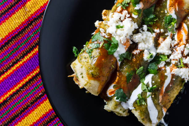 istock Chicken Filled Green Enchiladas, Traditional Mexican Meal 1217897397