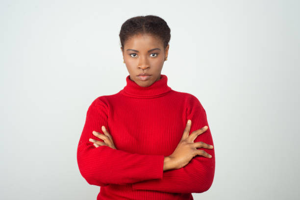 istock Serious strict black woman wearing red sweater 1217900994