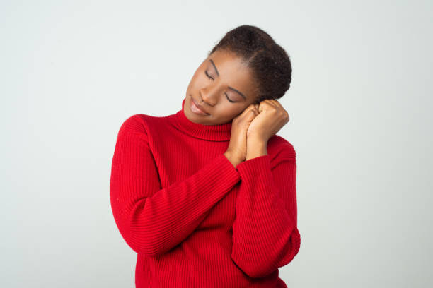istock Peaceful black woman in red sweater 1217901094