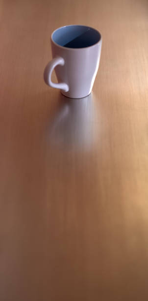 istock front view of a white cup on a metallic background 1217903601