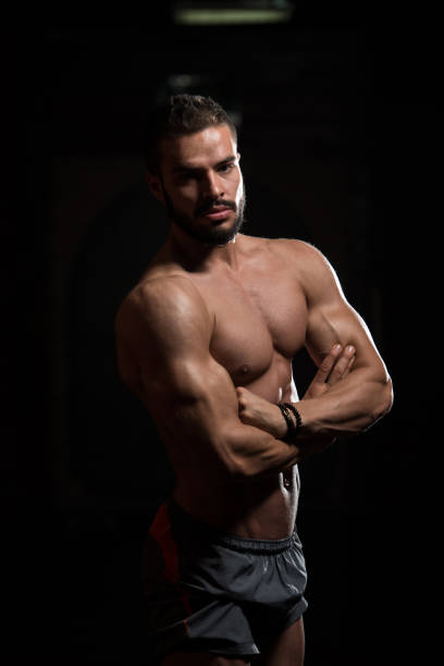 istock Model In Gym Showing His Well Trained Body 1217909164