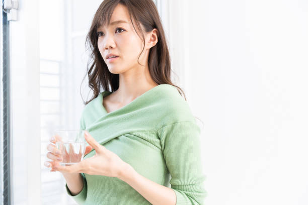 istock asian woman who drinks water 1217912006