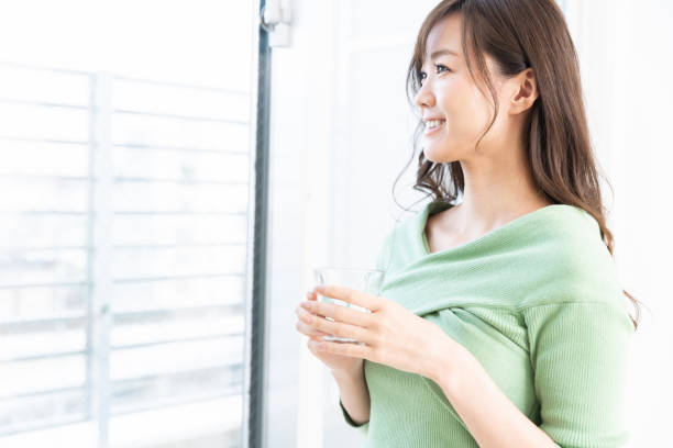 istock asian woman who drinks water 1217912192