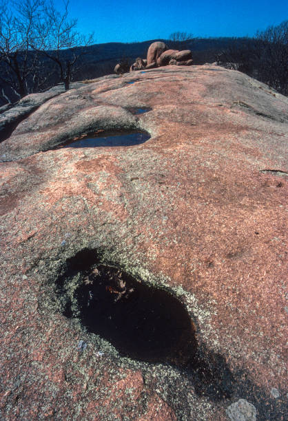 istock Elephant Rocks State Park - Potholes in Pink Granite Vertical - 2002 1217915087