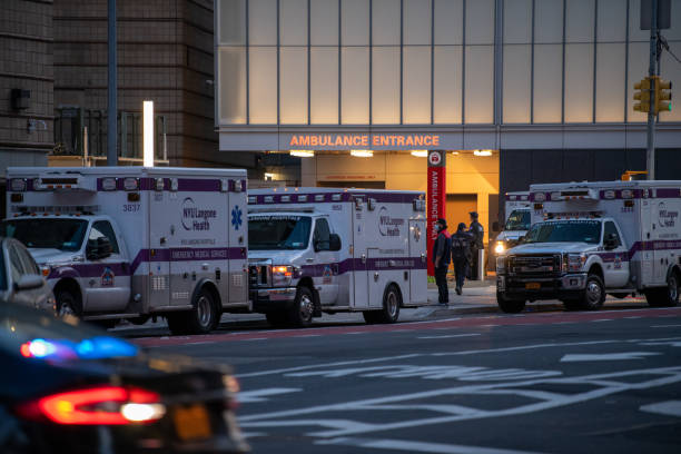 First responders waiting to be deployed during the pandemic in New York Crews of EMTs and their ambulances are waiting to be sent out to pick up sick people during the pandemic in New York City. paramedic photos stock pictures, royalty-free photos & images