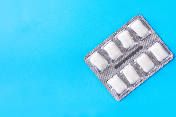 Chewing gum on a beautiful blue background with space for your inscription. Beautiful photo