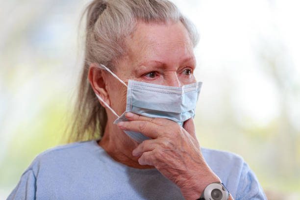 istock Old woman portrait with a protection mask 1217920185