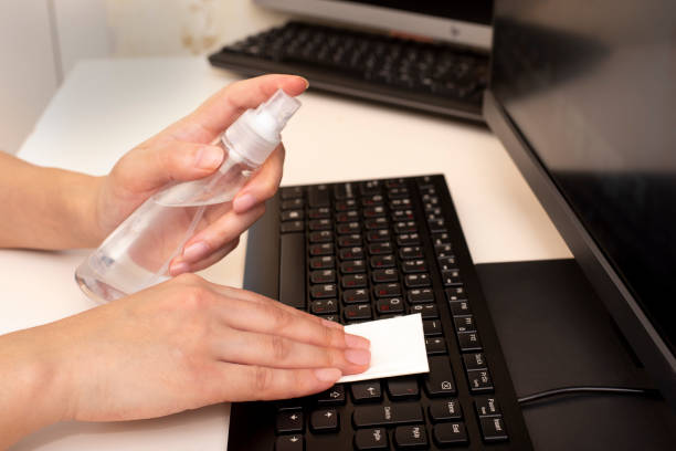 istock Disinfecting the computer with an antiseptic. Protection against coronavirus and other viruses. Wiping the keyboard. 1217922965