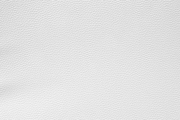 istock Close up detail white, bronze, silver leather and texture background 1217923339